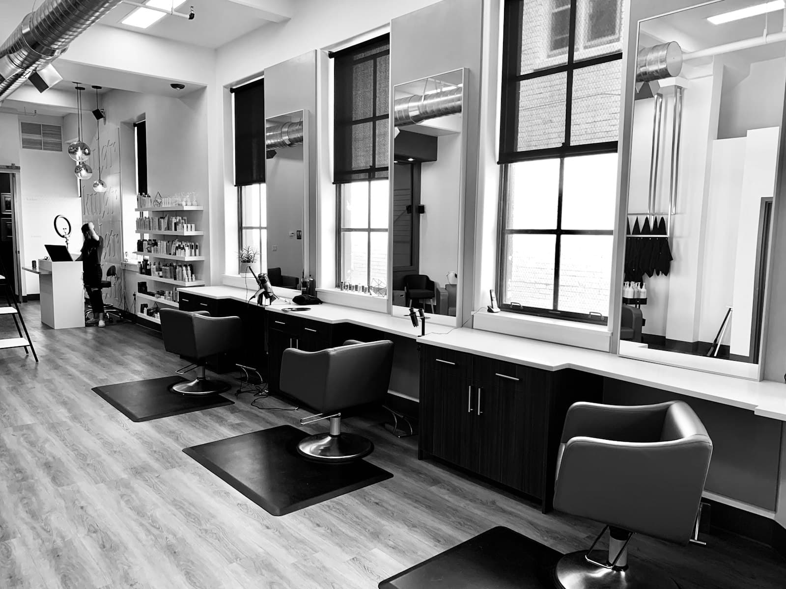 A beautician working with a client in her studio