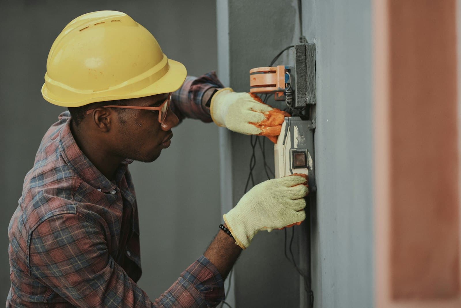A plumber working on a job at a customer's property