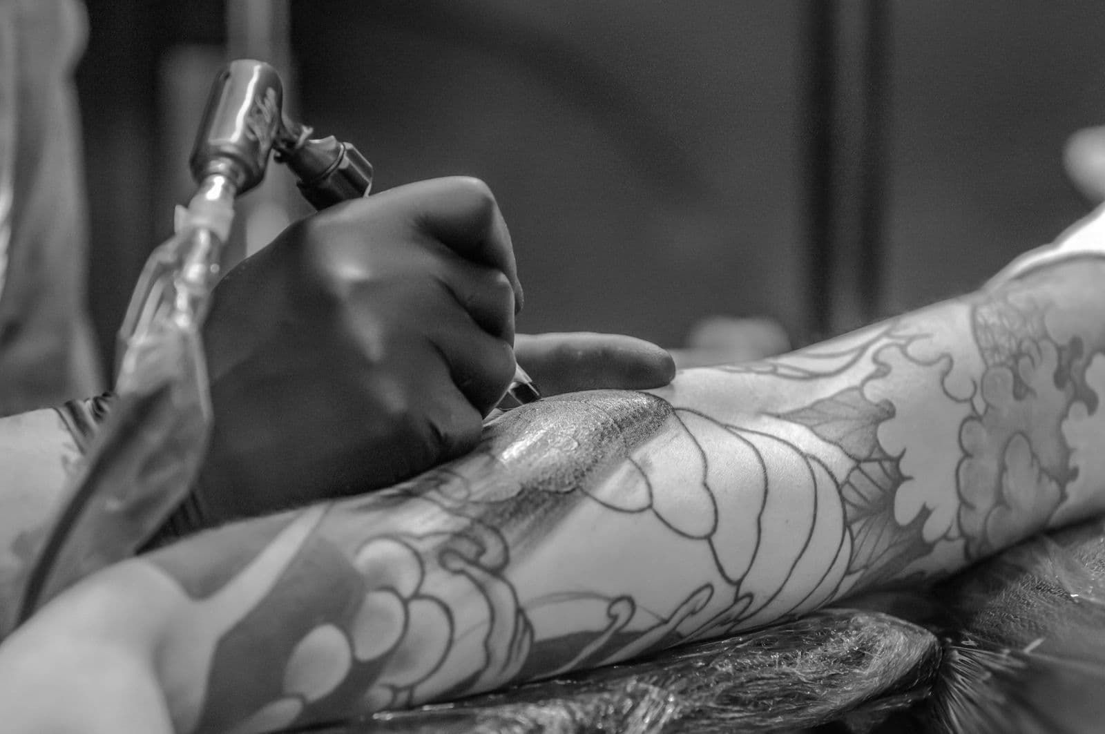 A tattoo artist at work in her studio