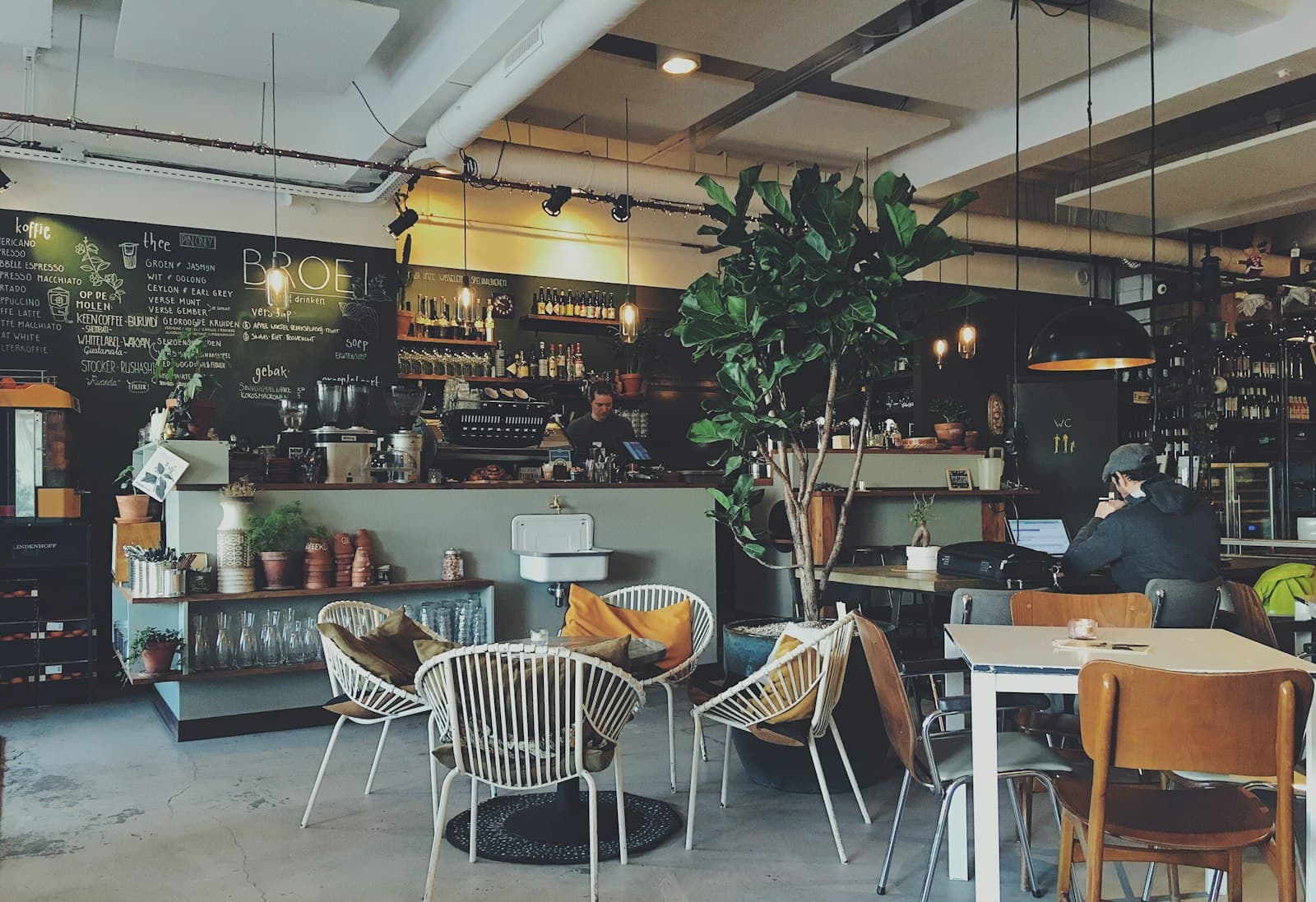 A café owner behind the counter